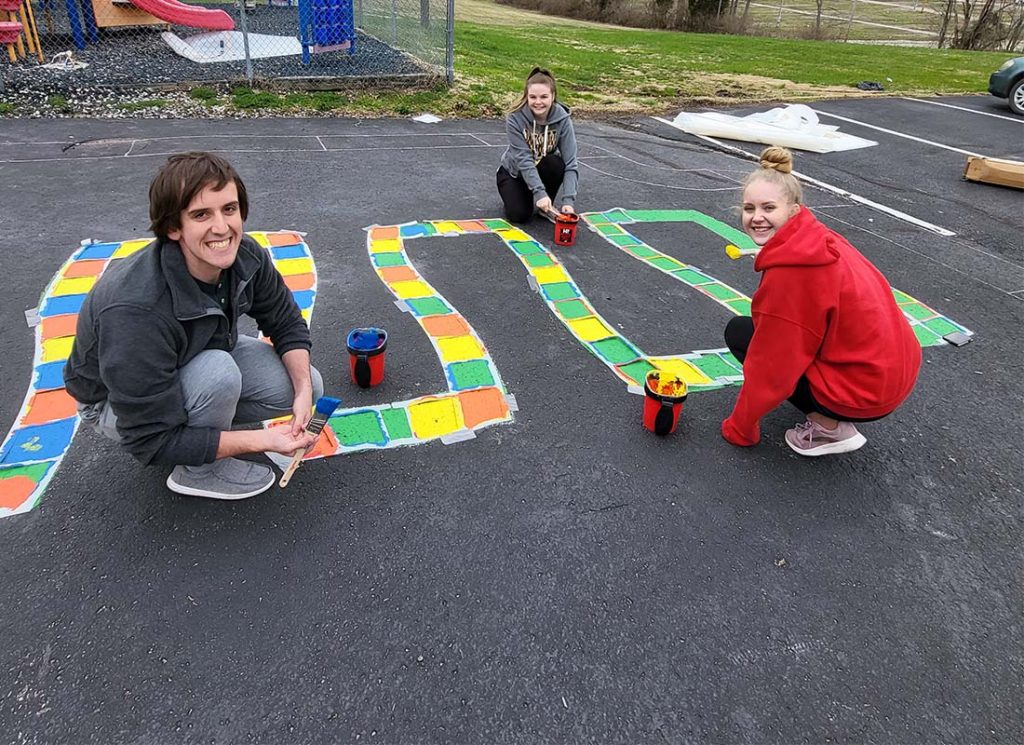 WVU Parkersburg’s Kappa Delta Pi Honor Society Paints Sensory Pathways for Jackson County School